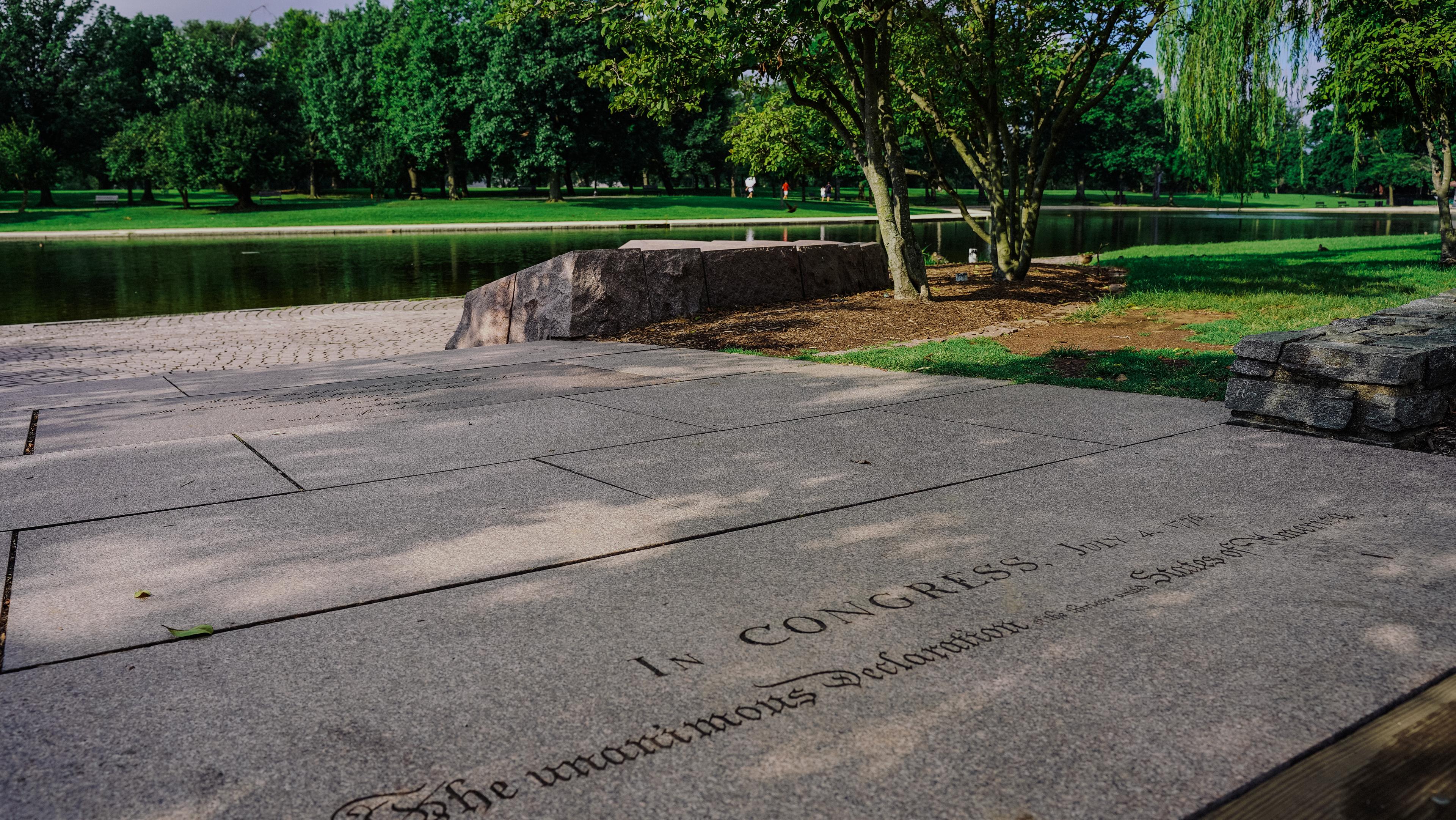 Photograph of 56 Signers of the Declaration of Independence Memorial and Constitution Gardens Pond as seen from Signer's Island footbridge