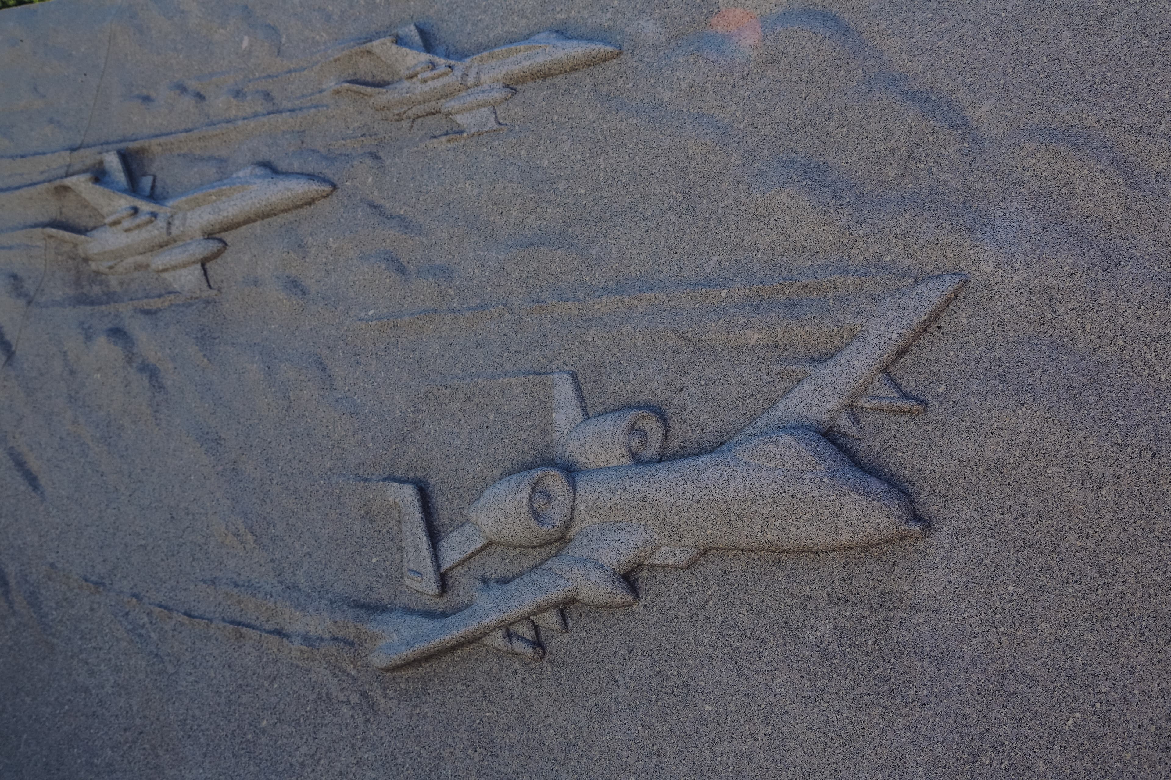 Close up of the Desert Shield bas-relief on the Storm Wall showing an A-10 Thunderbolt II and a pair of F-15 Strike Eagles